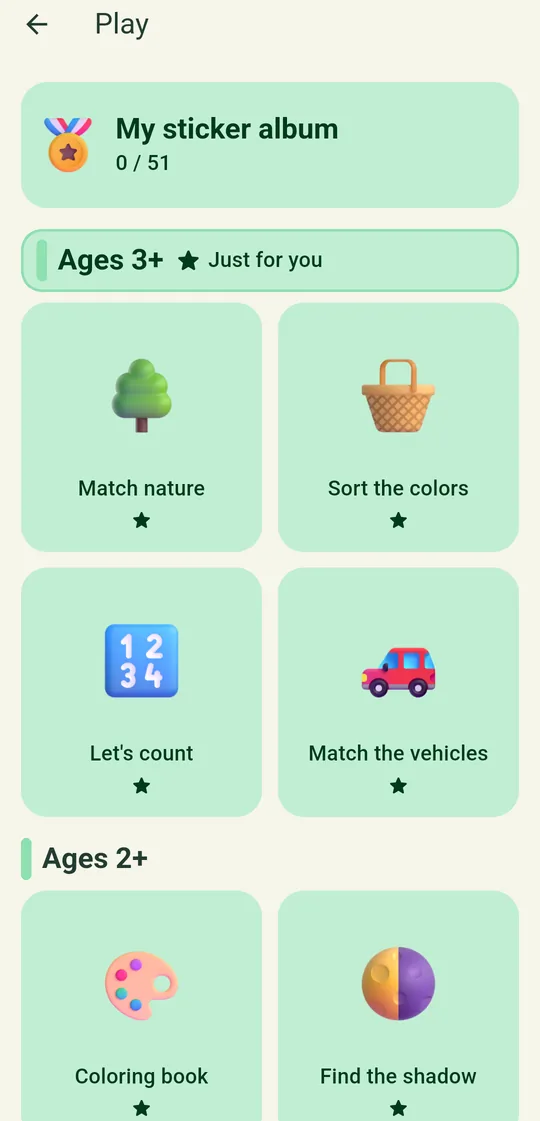 Play screen: game boxes by age group and the sticker album