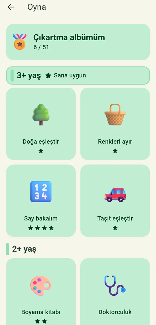 Oyna ekranı: yaş gruplarına göre oyun kutuları ve çıkartma albümü